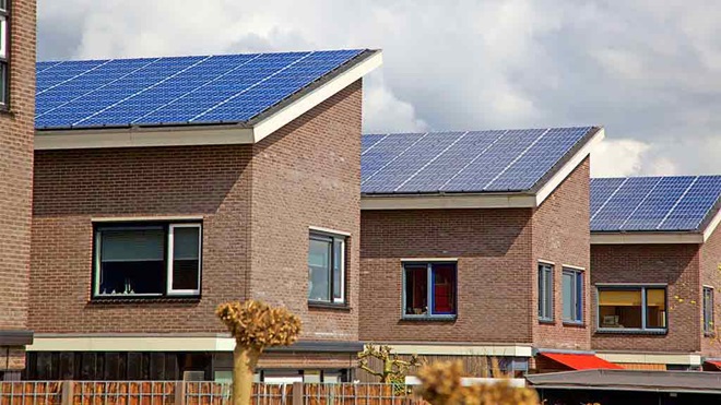 row of houses with solar panels